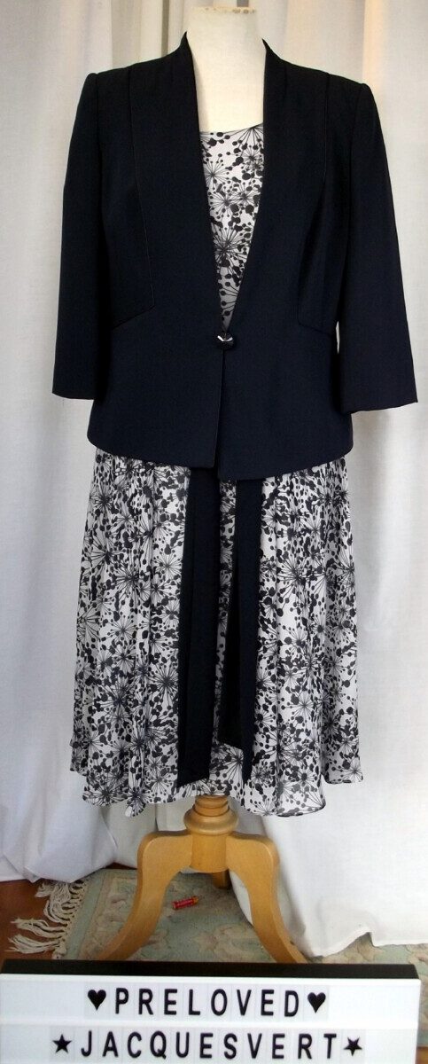 Grey chiffon dress with navy blue seedhead print matching navy blue jacket